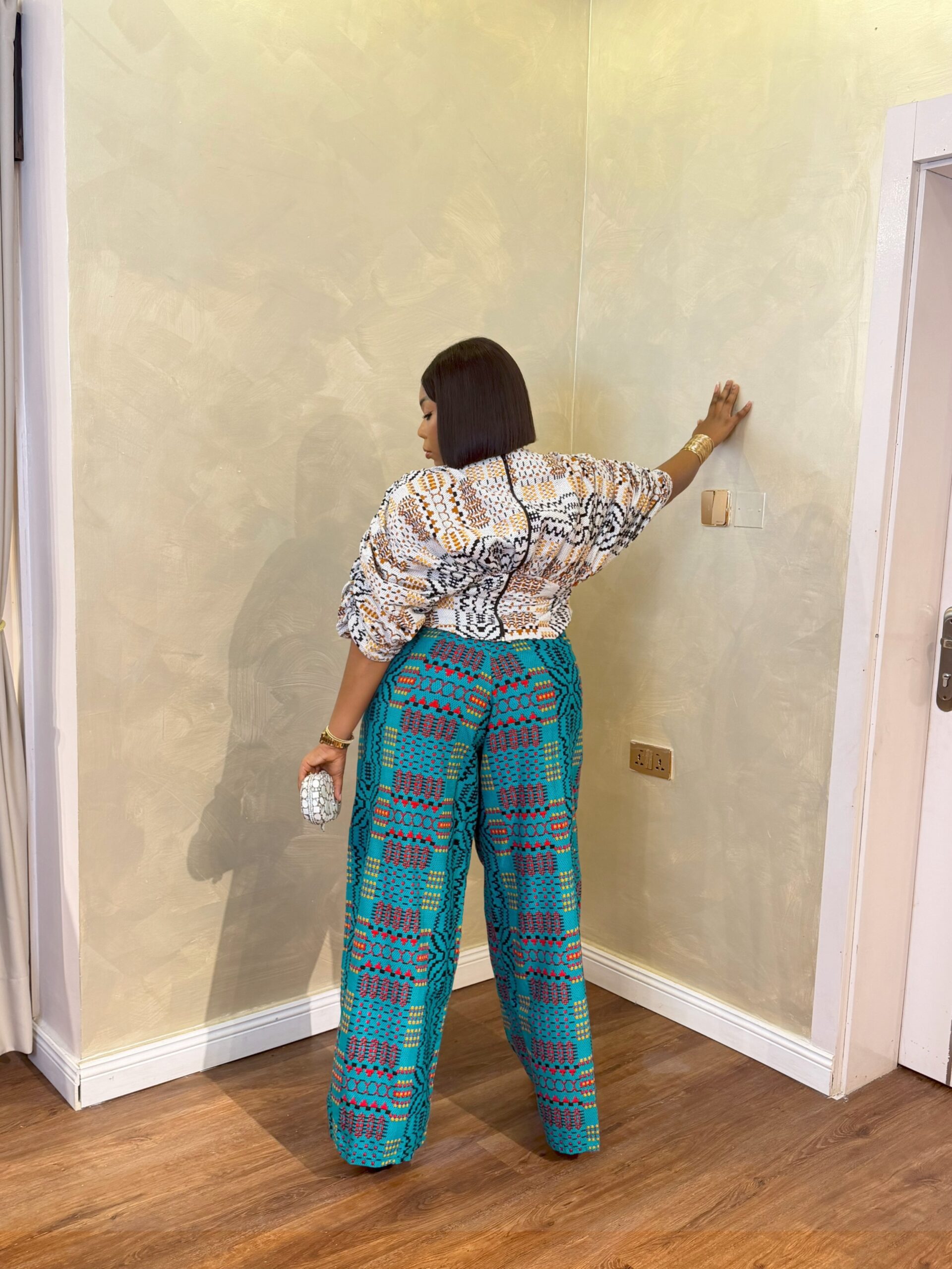 Elegant Ankara Pant Set for Women featuring vibrant wide-leg African print trousers and a stylish patterned top.