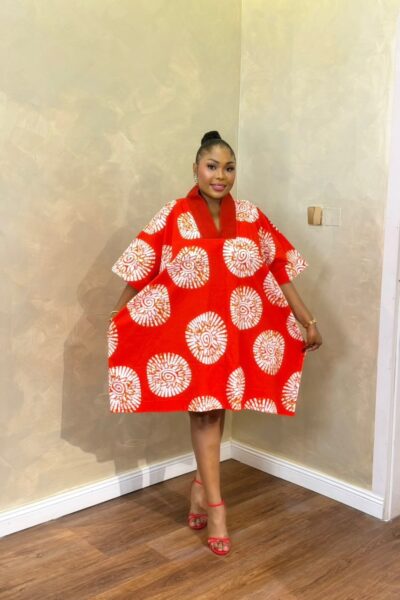 Woman wearing a red and white Short Eko Bubu with open-back detail
