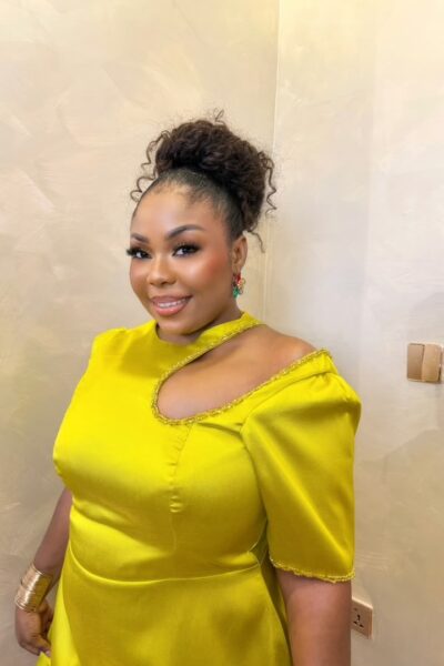 Amaartini Dress – bright yellow women's mini dress with puff sleeves, asymmetrical cut-out neckline, fitted bodice, and flared skirt.